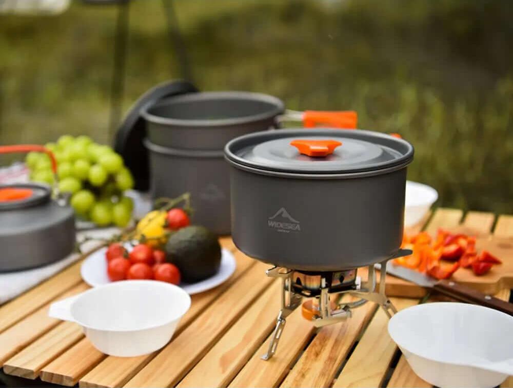 {{Camping Gear {{ Hiking Gear }} }} - {{Tac Treasure Shop }} {{ Outdoor Cookware }} {{ Set Displayed on Picnic Table}}